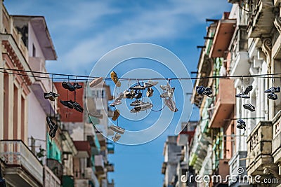 Old Shoes. Hanging shoes. Editorial Stock Photo