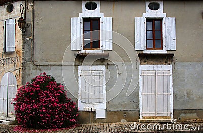 Old shuttered windows and old stonework, France Stock Photo