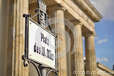 Old signboard with caption Platz Des 18. Marz written in old German font as a symbol of central Berlin Stock Photo