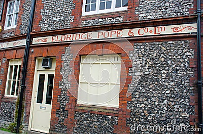 Old signboard of Eldridge Pope Brewers traditional English Ale suppliers Editorial Stock Photo