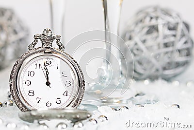 Old silver clock close to midnight and Christmas decorations Stock Photo