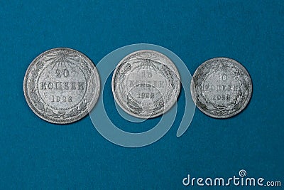 old silver soviet coins lying on a blue table Stock Photo