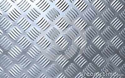 The old silver steel checkered plate background with scratches texture and light reflection on surface Stock Photo