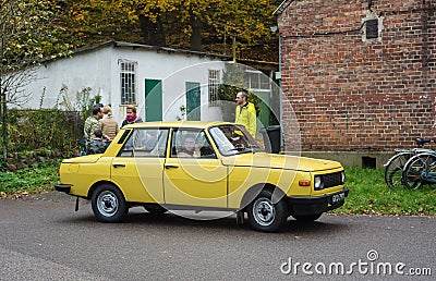 Old simple cheap east German car Wartburg driving at a car show Editorial Stock Photo