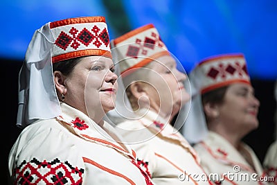Old Slavic women sing songs. Belarusians in national headdresses Editorial Stock Photo