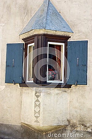 Old Small balcony with wooden windows - Engadine Valley Switzerland Stock Photo