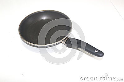 Small black frying pan with teflon surface isolated on white background Stock Photo