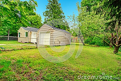 Old small fixer-upper house. Backyard view Stock Photo