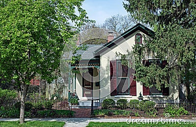 Small Cottage in Trees Stock Photo