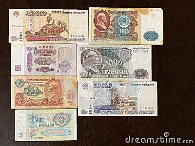 Old Soviet banknotes in denominations of three, five, twenty-five, fifty, one hundred rubles on a dark background Stock Photo