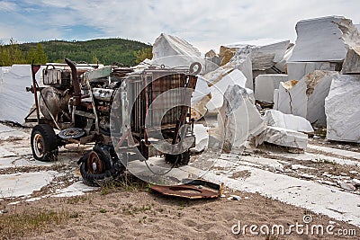 Old soviet broken rusty compressor in an abandoned marble quarry. Stock Photo