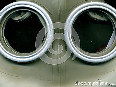 Old Soviet green gas mask. The eye of an old gas mask. postapocalypse. Stock Photo