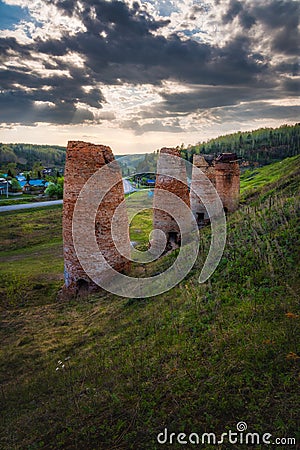 Old soviet lime kilns under a cloudy sky on a summer day Stock Photo