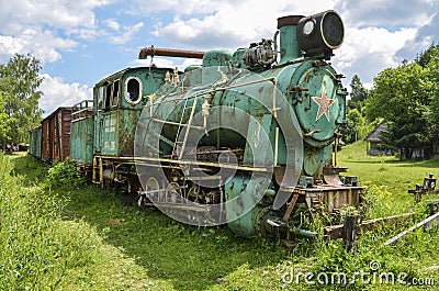 Old Soviet locomotive stands on narrow-gauge railway. Old Village museum, Kolochava, Ukraine Editorial Stock Photo