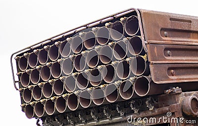 The old Soviet multiple launch rocket system BM-21 Grad on the chassis of a truck Ural-375D. Broken and burnt military equipment Stock Photo