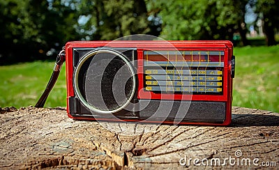 Old Soviet radio on a wooden background. Stock Photo