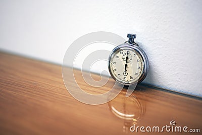 Old Soviet stopwatch on a wooden table Stock Photo