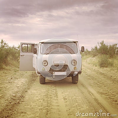 Old soviet style minibus in the desert Stock Photo