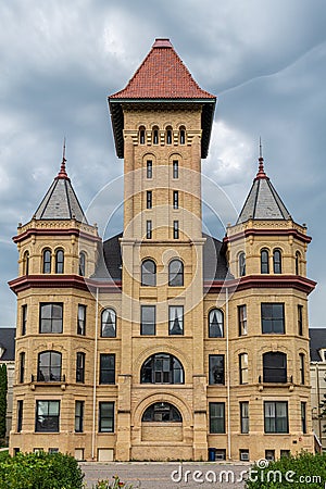 The old State Hospital against an eerie dark sky in Fergus Falls, Minnesota U Stock Photo