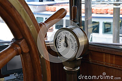 Old steamboat bridge, steering wheel and commanding gear Stock Photo
