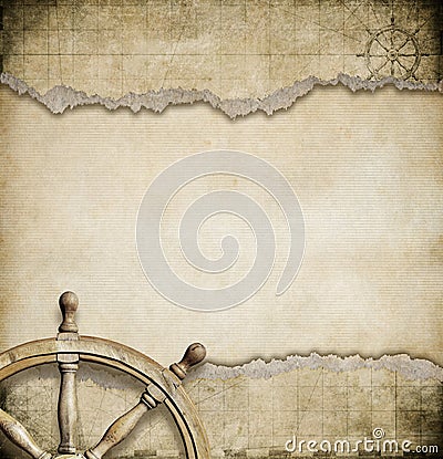 Old steering wheel and torn nautical map Stock Photo