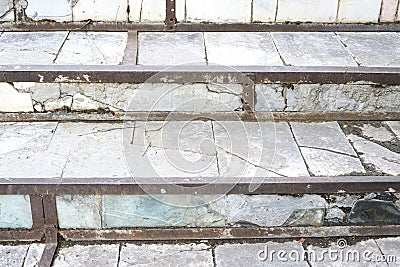 Old steps of stairs. Destroyed light tiles Stock Photo