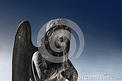 Old stone angel in prayer. Special effect religion, Christianity, faith concept Stock Photo
