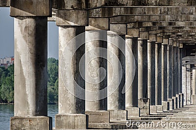 Old stone columns. Ancient colonnade. Corridor with columns Stock Photo