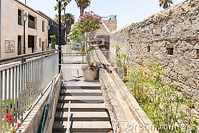 An old stone conduit on one of the quiet side streets near the main pedestrian HaMeyasdim in Zikhron Yaakov city in northern Editorial Stock Photo