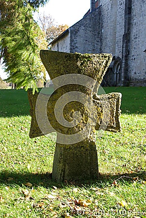 Old stone cross in churchyard Stock Photo