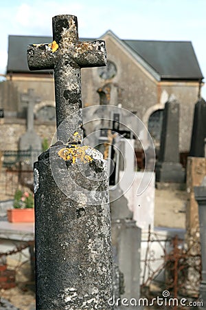 Old stone cross at a churchyard Stock Photo