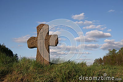 Old stone cross with sword symbol Stock Photo