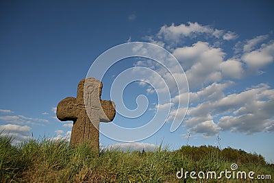 Old stone cross with sword symbol Stock Photo