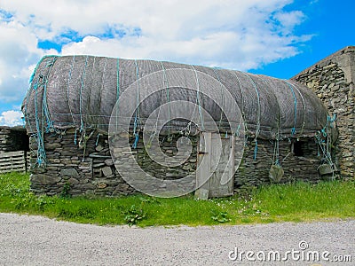 Old Stone debilitated thatched cottage Stock Photo