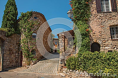 Old stone houses in alley under blue sky at Les Arcs-sur-Argens. Editorial Stock Photo