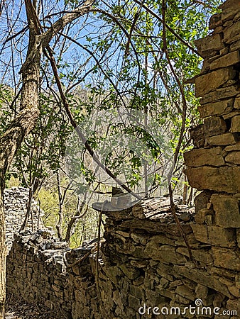 old stone houses in ticino. Derelict stone huts near the Monte Generoso mountain in Lugano. Nice hiking area.Spring time Stock Photo