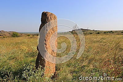 Old stone idol in steppe Stock Photo