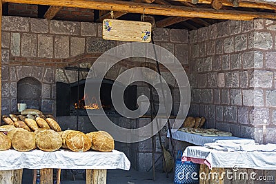 Old stone oven and breads Stock Photo