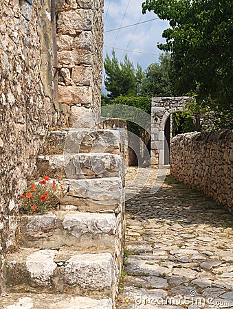 Old stone paved path, fence and stair Stock Photo