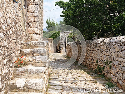 Old stone paved path, fence and stair Stock Photo