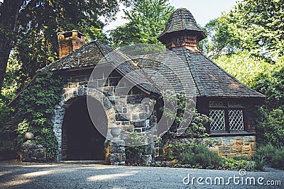Old stone pumphouse in tudor revival architecture Stock Photo