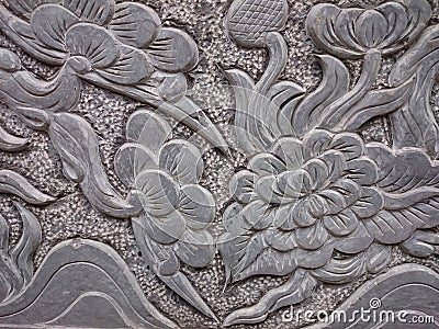 Old stone relief in buddhist temple in Vietnam, South-East Asia. Stock Photo