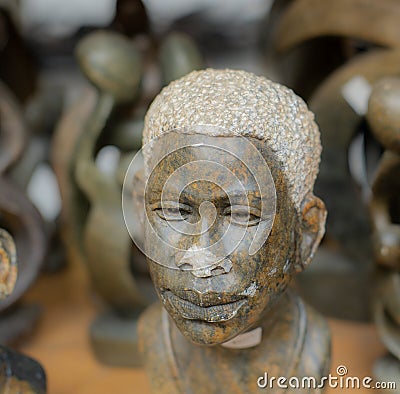 Old stone sculpture of African man Editorial Stock Photo