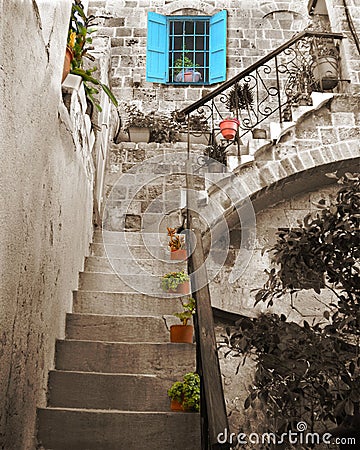 Old stone stairs and blue window Stock Photo