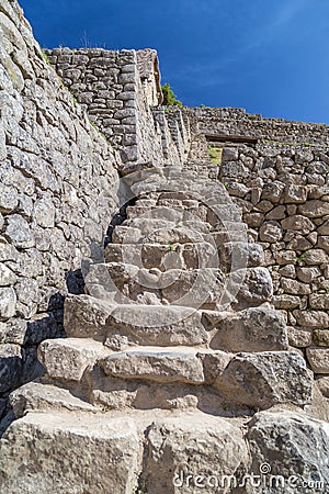 Old Stone stairs in Machu Picchu sacred city of Incas in Peru Stock Photo