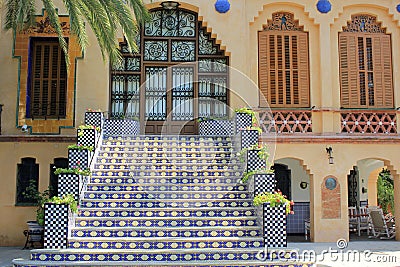 Old stone stairway of a palace with wrought iron banister in a park Stock Photo
