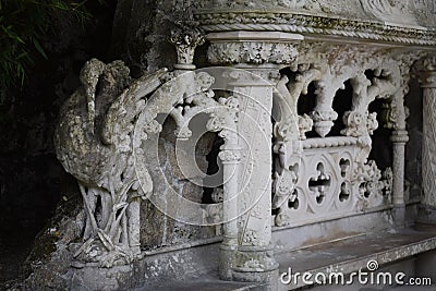 Old stone statue of heron in manueline style, Quinta da Regaleira Palace in Sintra, Portugal. Stock Photo