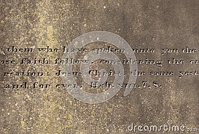 Old stone surface with the engraved words from Hebrews Stock Photo
