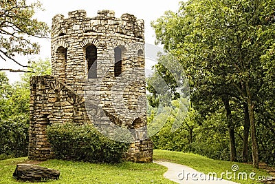 Old Stone Tower in Lush Green Scenery Stock Photo