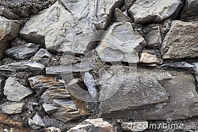 An old stone wall brown large stones. Classical masonry walls of medieval castles in Europe. Stock Photo